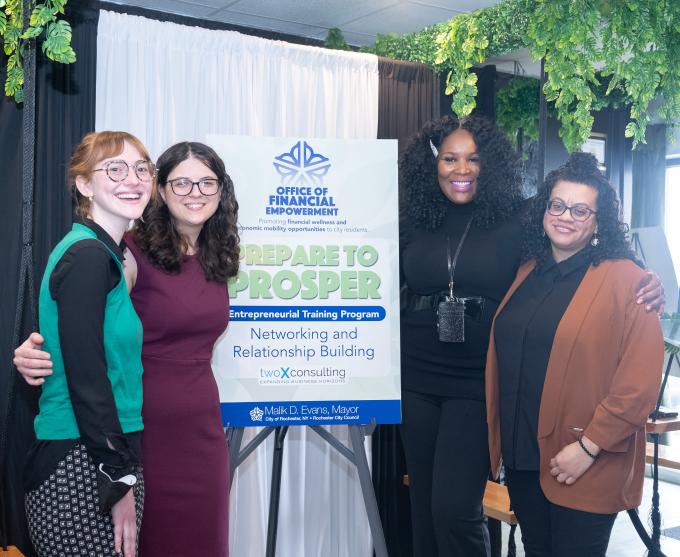 Photograph of people at an Office of Financial Empowerment event.