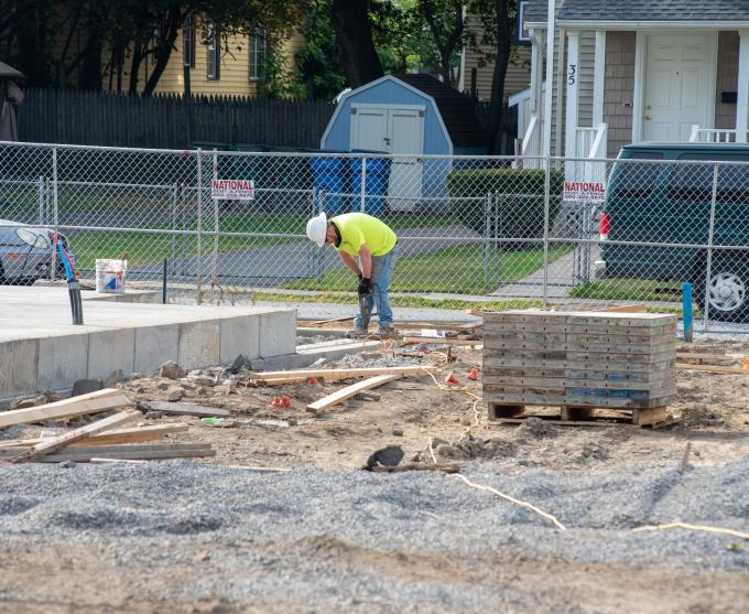 Photograph of a construction worker at a job site.