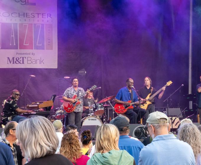 Photo of a band playing on a stage at the 2023 Rochester Jazz festival