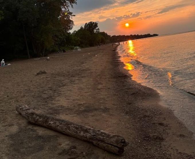 Photo of Durand Eastman Beach at sunset during summer 2024.