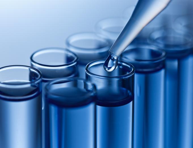 Photo of water samples being tested in a lab.