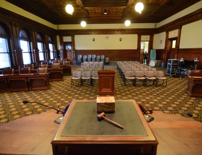 Photograph of a gavel on a desk inside Rochester City Council Chambers.